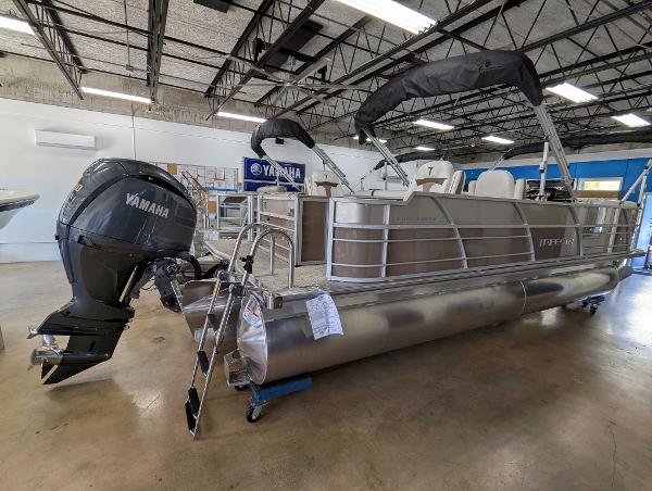 Trifecta 24RFC CS 2025 Trifecta 24RFC CS pontoon boat with Yamaha outboard motor in showroom.