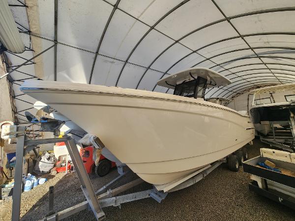World Cat 280 CC-X 2024 World Cat 280 CC-X boat in covered storage, side view.