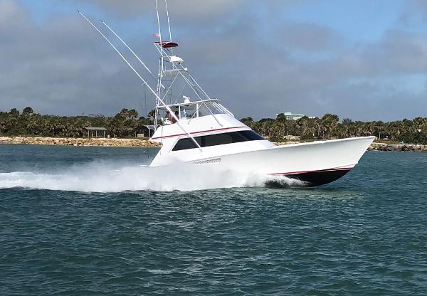 Custom Carolina Lydia 57 Sportfish Custom Carolina Lydia 57 Sportfish 2001 cruising on open water, showcasing sleek design and speed.