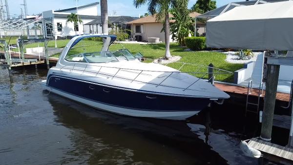 Formula 37 Performance Cruiser 2003 Formula 37PC boat docked near waterfront homes.