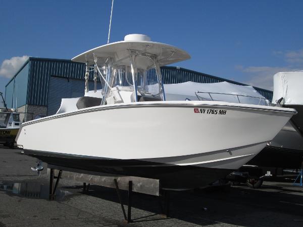 Jupiter 26 Forward Seating 2012 Jupiter 26 Forward Seating boat on display in a marina setting.