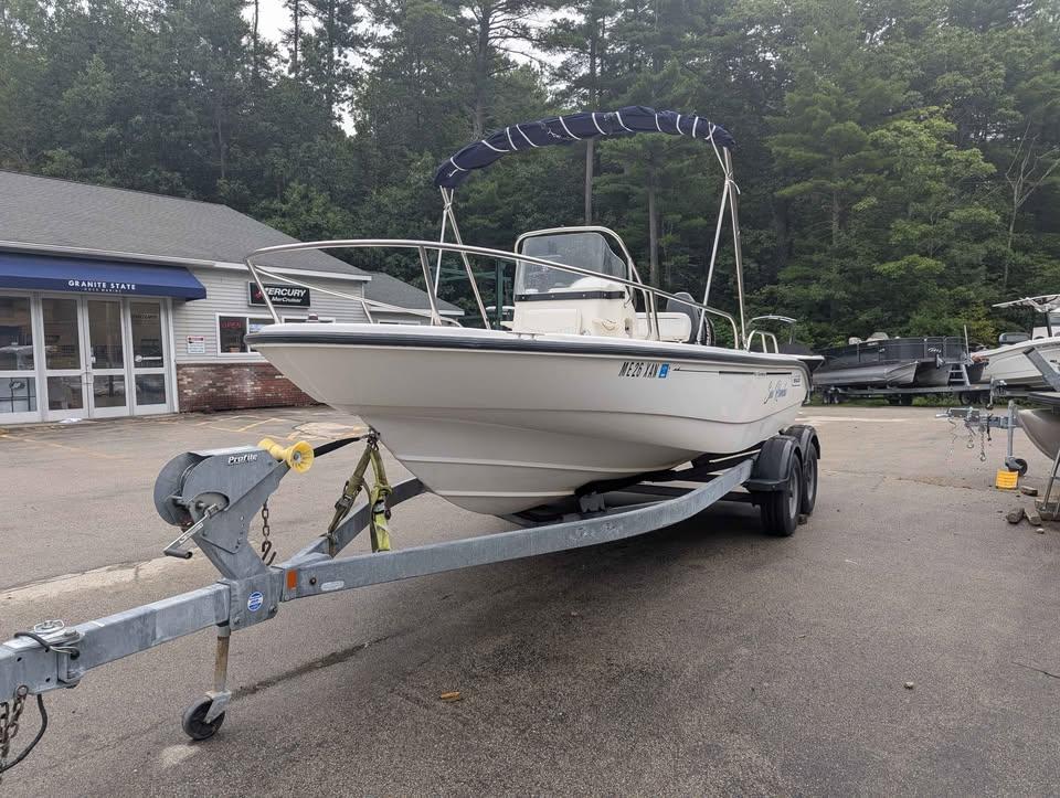 Boston Whaler 180 Dauntless 2005 Boston Whaler 180 Dauntless boat on trailer, parked outside dealership.
