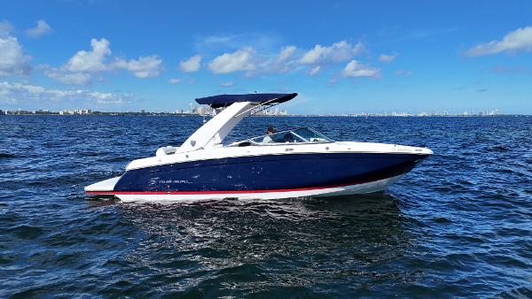 Regal 26 FasDeck 2018 Regal 26 FasDeck boat cruising on open water under a clear blue sky.