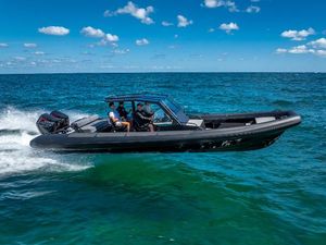Goldfish X10 Scout 2024 Goldfish X10 Scout boat cruising on open water under a clear blue sky.