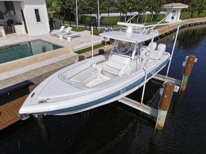 Intrepid 327 2017 Intrepid 327 boat docked near luxury waterfront home.