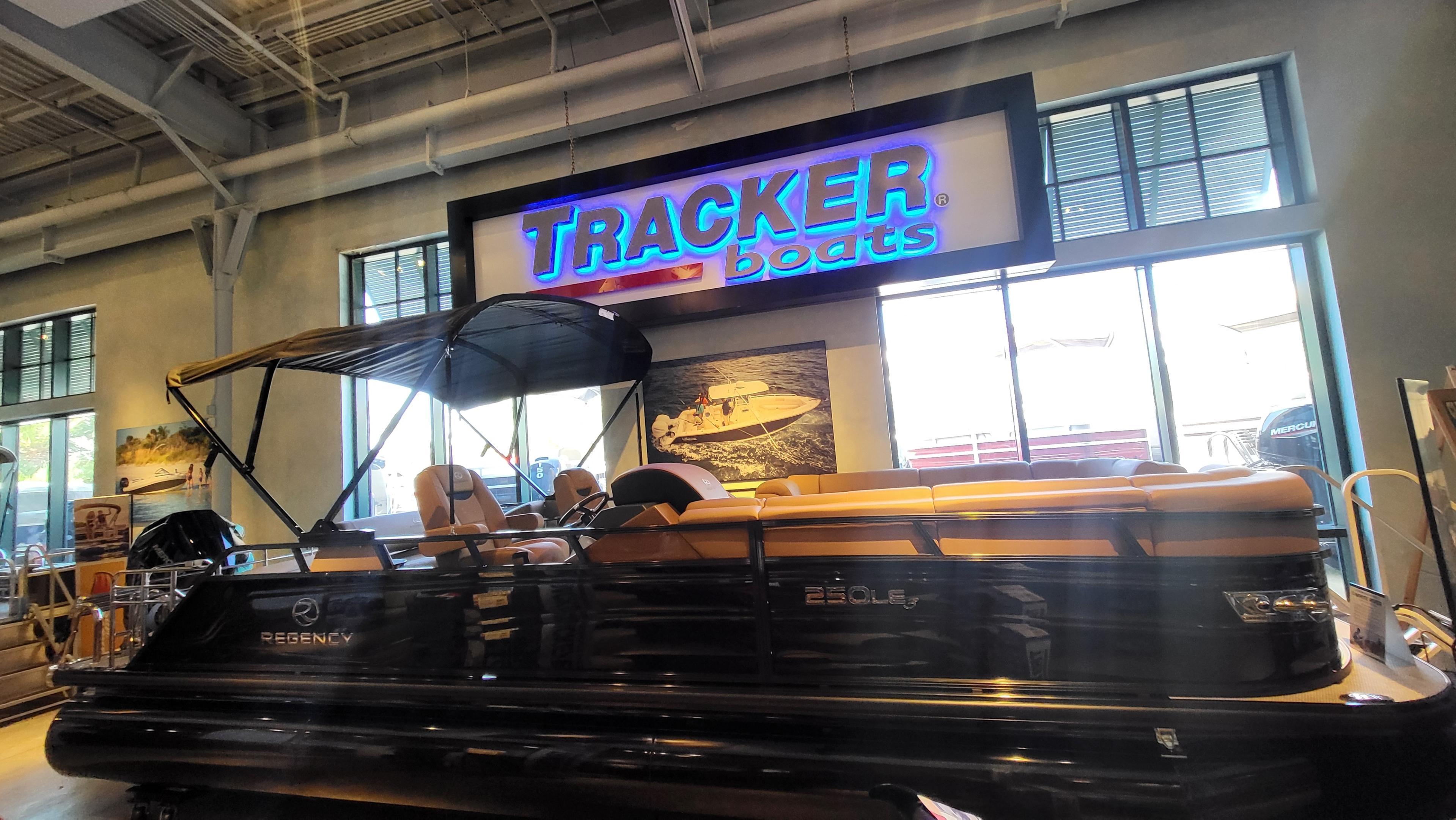 Regency 250 LE3 Sport 2025 Regency 250 LE3 Sport boat displayed at Tracker Boats showroom.