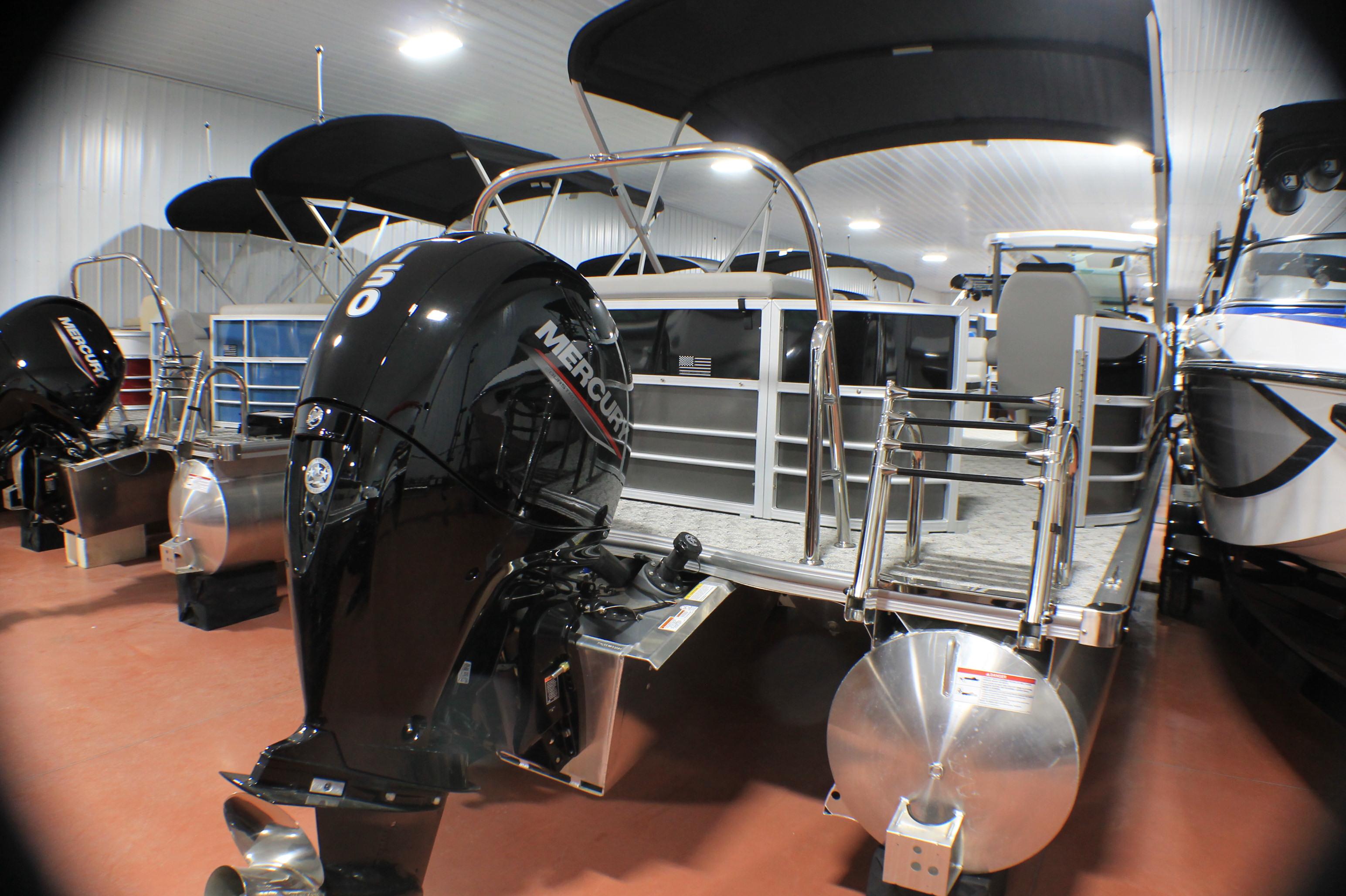 Berkshire 22 CL LE 2025 Berkshire 22 CL LE pontoon boat with Mercury outboard engine in showroom.