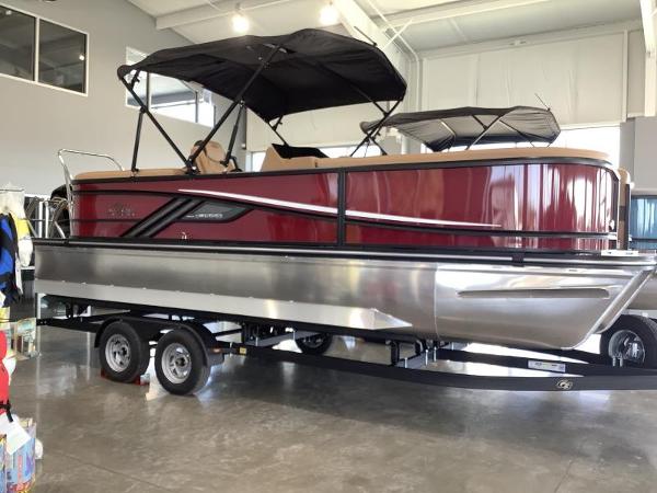 G3 Fusion 322RC 2025 G3 Fusion 322RC pontoon boat with red exterior on a trailer in showroom.