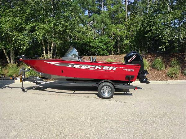 Tracker Pro Guide V-175 WT 2025 Tracker Pro Guide V-175 WT boat in vibrant red on a trailer.