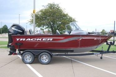 Tracker Targa V-18 Combo 2018 Tracker Targa V-18 Combo boat on trailer, parked outdoors.