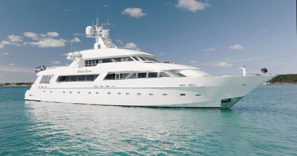 Cheoy Lee 145 Global Series Long Range Tri Deck Luxurious 1996 Cheoy Lee 145 Global Series yacht on serene blue waters.