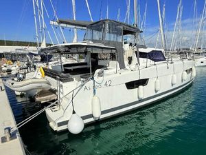 Fountaine Pajot Catamaran Astrea 42 2020 Fountaine Pajot Catamaran Astrea 42 docked in a marina, surrounded by other boats.