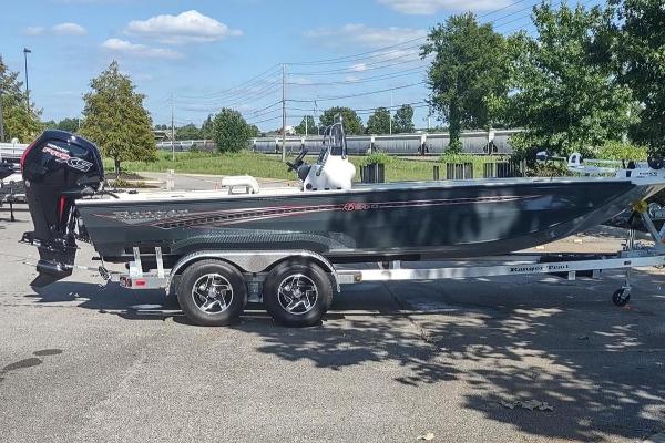 Ranger RB200 2023 Ranger RB200 boat on a trailer in a parking lot.