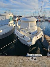 Custom ARVOR Custom ARVOR 2007 boat docked in a marina, surrounded by other vessels.