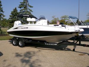 Tahoe 2150 CC 2024 Tahoe 2150 CC boat on trailer, parked outdoors, sunny day.
