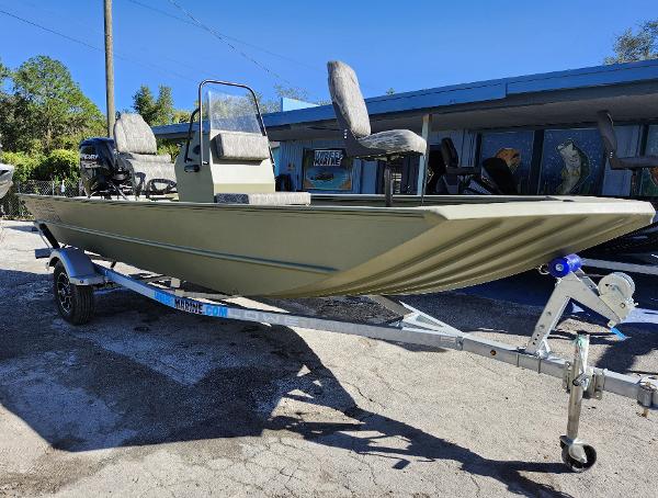 Lowe Roughneck 1860 CC 2025 Lowe Roughneck 1860 CC boat on trailer, parked outdoors.