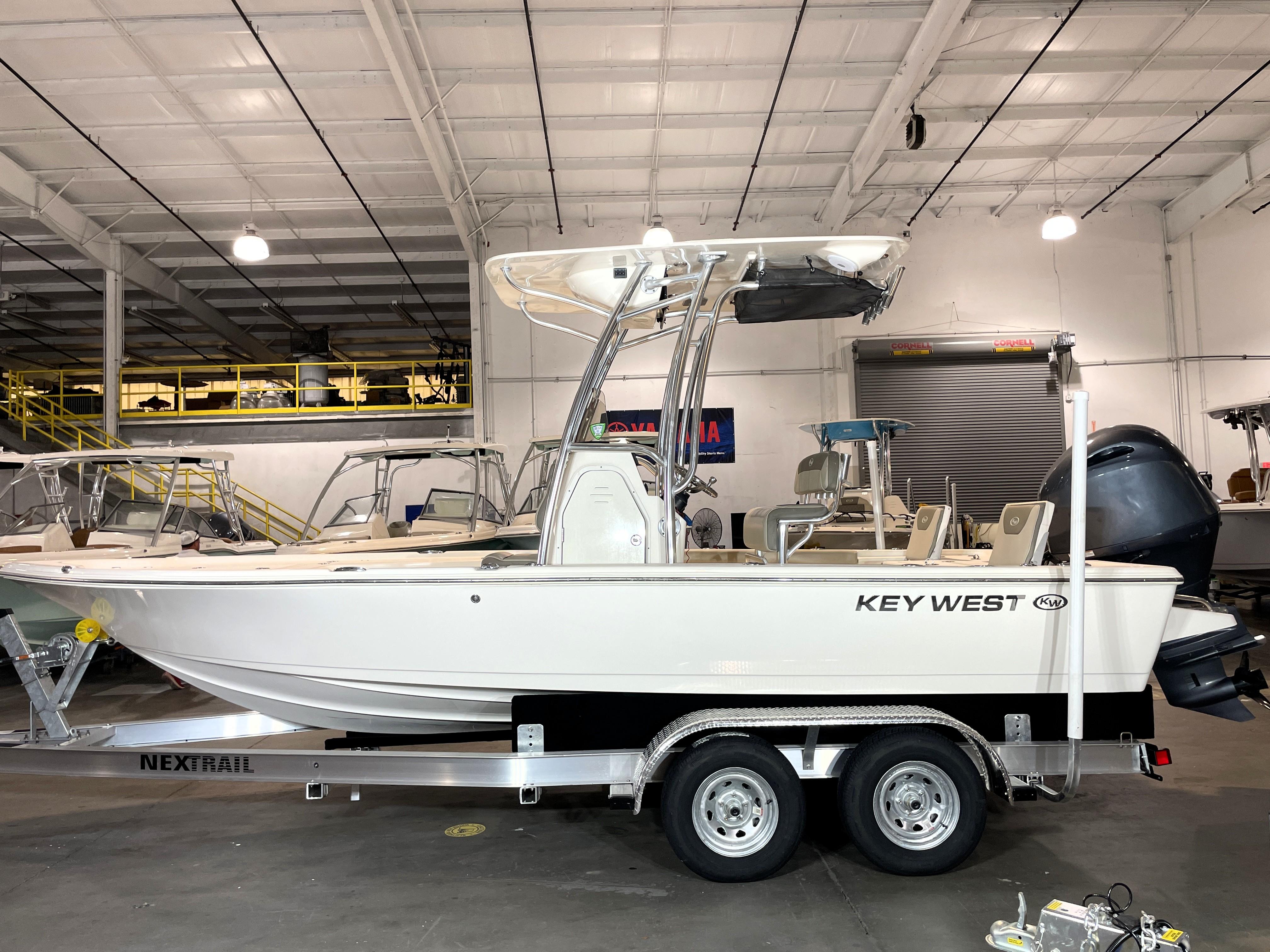 Key West 210 Bay Reef 2021 Key West 210 Bay Reef boat on trailer in indoor showroom.