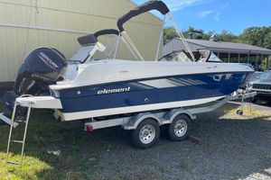 Bayliner Element E21 2024 Bayliner Element E21 boat on trailer, featuring a Mercury outboard motor.