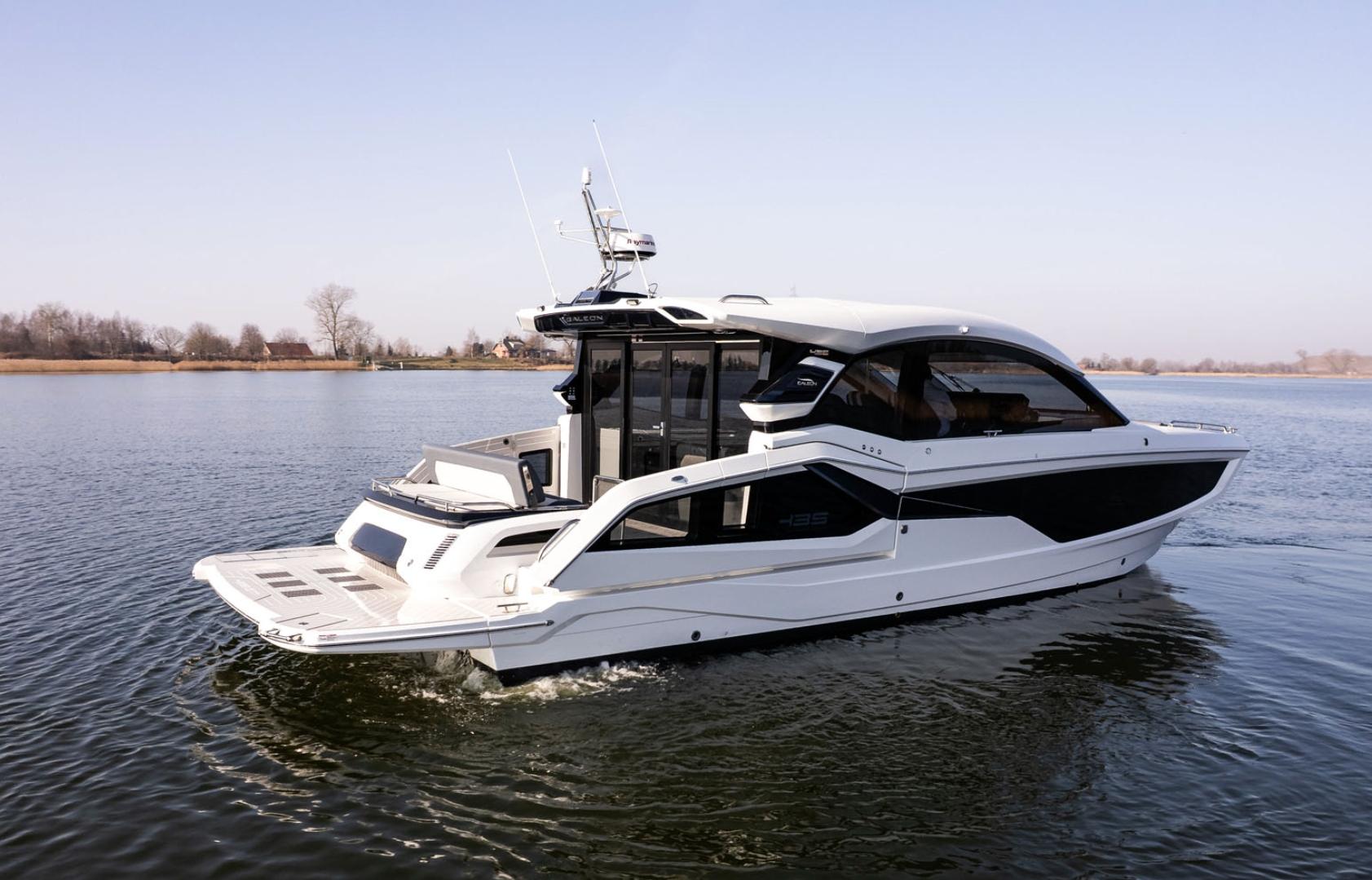 Galeon 435 GTI 2026 Galeon 435 GTI yacht cruising on a calm lake under clear skies.