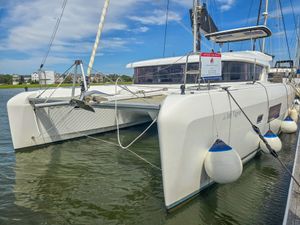 Lagoon 42 2019 Lagoon 42 catamaran docked, featuring sleek design and modern amenities.
