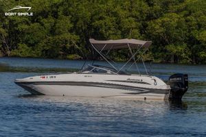 Hurricane SunDeck 217 OB 2022 Hurricane SunDeck 217 OB boat on calm water with lush green background.