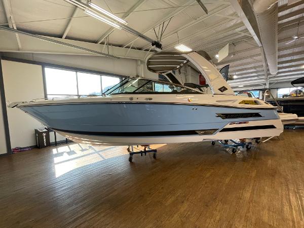 Monterey 278 Super Sport 2024 Monterey 278 Super Sport boat displayed indoors on a wooden floor.