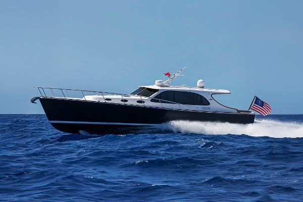 Palm Beach Motor Yachts PB45 2026 Palm Beach Motor Yachts PB45 cruising on open sea, displaying sleek design and American flag.