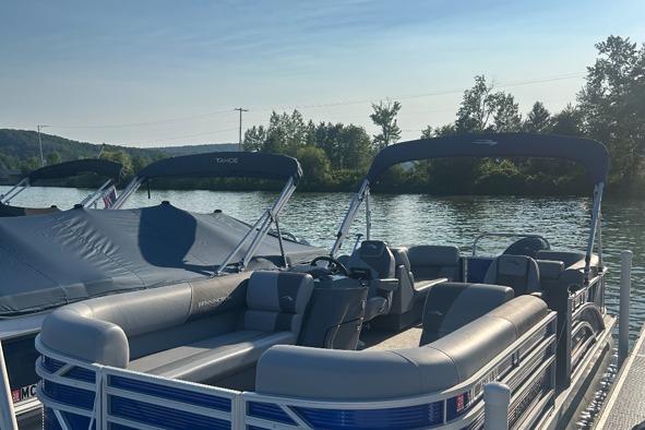 Bennington 22 SSR 2024 Bennington 22 SSR pontoon boat docked on a serene lake.