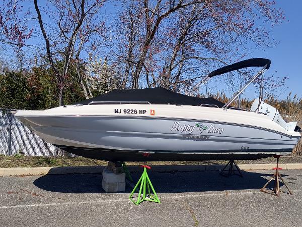 Stingray 192 SC 2021 Stingray 192 SC boat on stands, covered, with registration NJ 9226 HP.