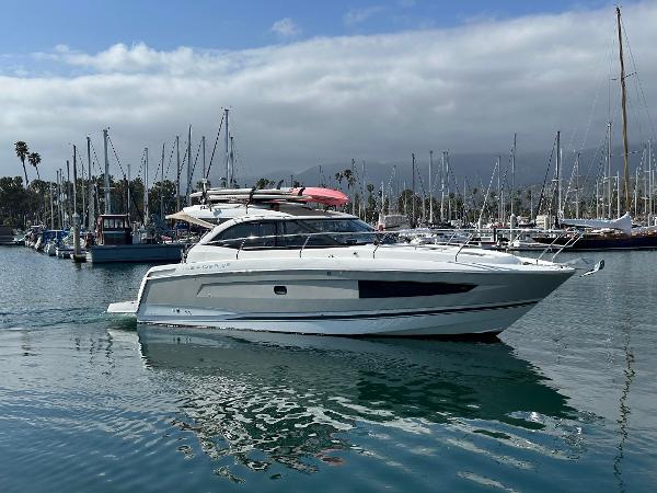 Jeanneau Leader 36 2016 Jeanneau Leader 36 yacht in a marina with sailboats and cloudy sky.