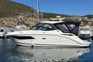 Sea Ray Sundancer 320 2017 Sea Ray Sundancer 320 yacht docked in a scenic marina.