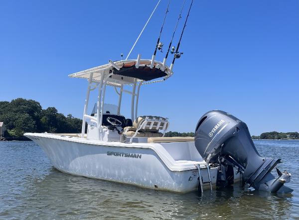 Sportsman Heritage 211 Center Console 2019 Sportsman Heritage 211 Center Console boat with Yamaha engine on calm water.