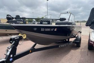 Crestliner 1850 Fish Hawk 2022 Crestliner 1850 Fish Hawk boat on trailer, parked outdoors under cloudy skies.