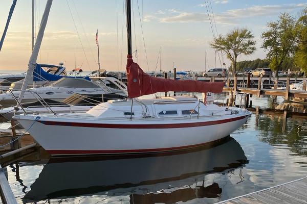 Ericson 25+ 1981 Ericson 25+ sailboat docked at marina during sunset.