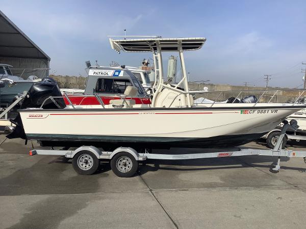 Boston Whaler 210 Montauk 2018 Boston Whaler 210 Montauk boat on trailer, parked outdoors.