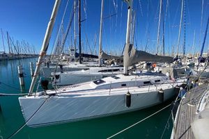 J Boats J/122 2007 J Boats J/122 sailboat docked in a marina under clear blue skies.