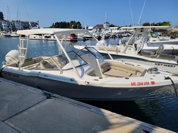 Key West 239 DFS 2023 Key West 239 DFS boat docked in a marina.