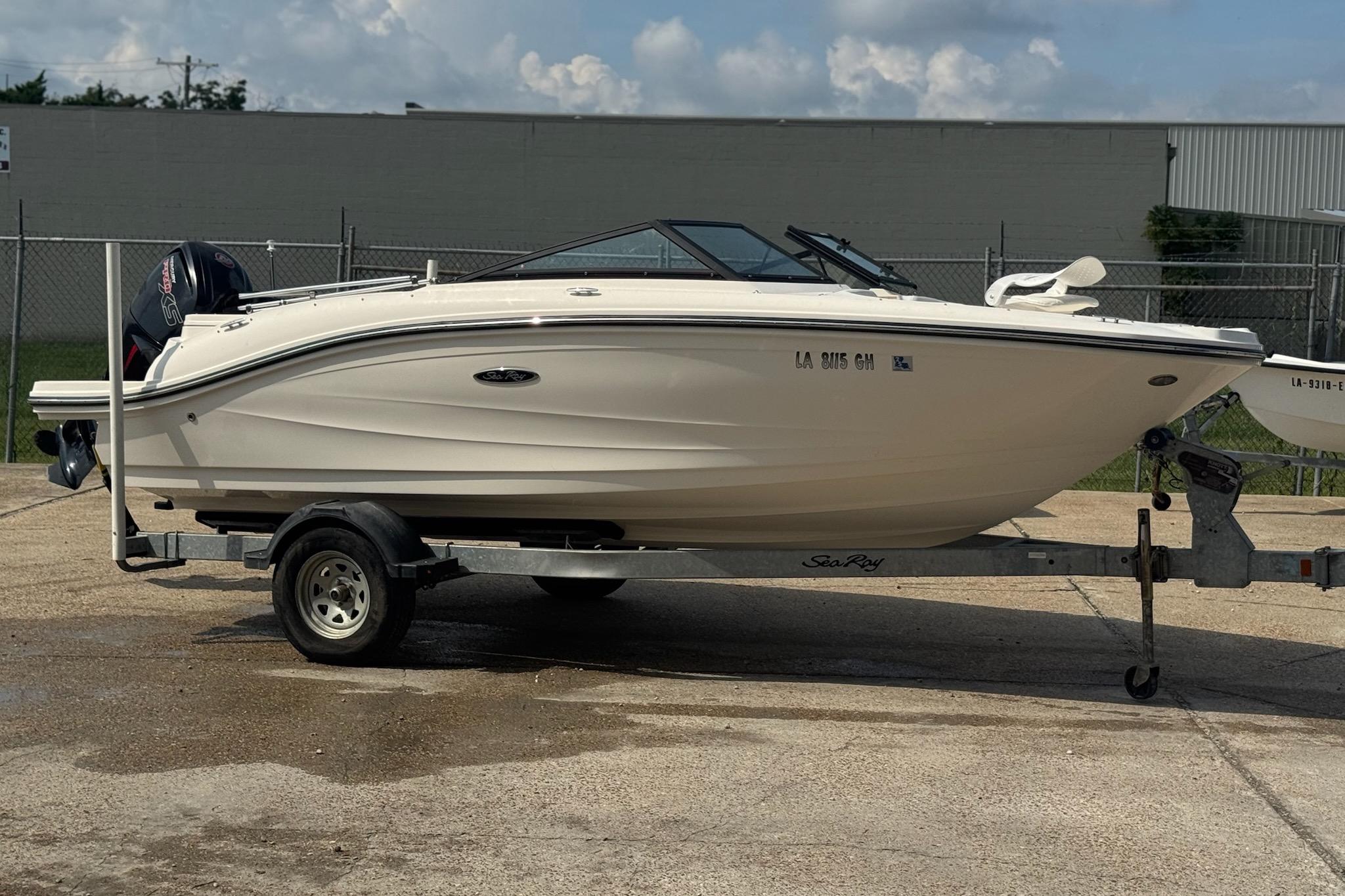 Sea Ray SPX 190 Outboard 2017 Sea Ray SPX 190 Outboard boat on trailer, parked outdoors.