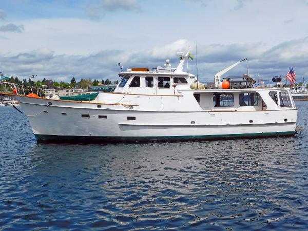 Grand Banks 55 Alaskan Pilothouse 1972 Grand Banks 55 Alaskan Pilothouse yacht on calm water, side view.