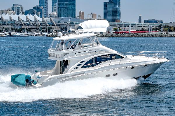 Sea Ray 58 Sedan Bridge 2008 Sea Ray 58 Sedan Bridge yacht cruising in urban waterfront setting.
