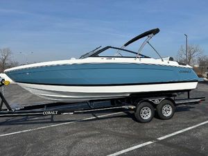 Cobalt R4 2024 Cobalt R4 boat on a trailer in a parking lot.