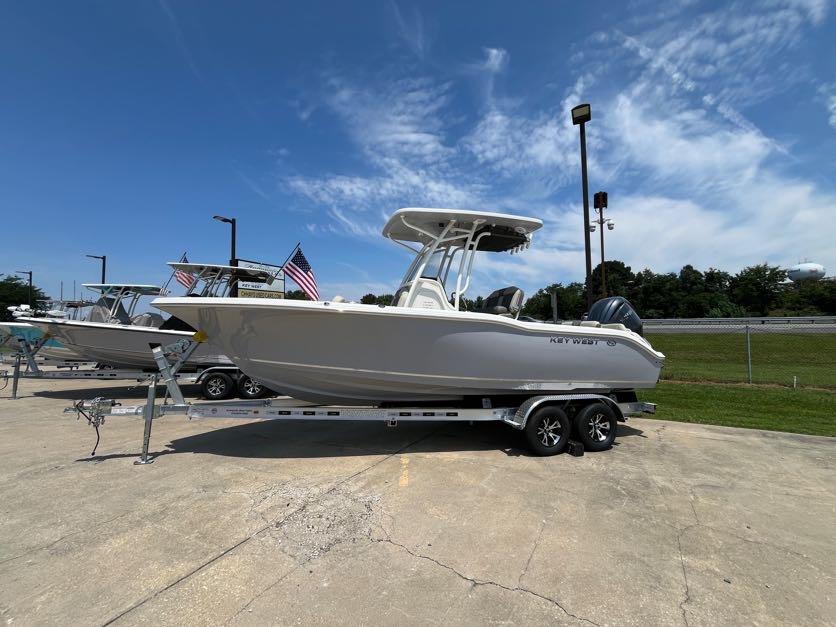 Key West 239 FS 2025 Key West 239 FS boat on trailer under clear blue sky.