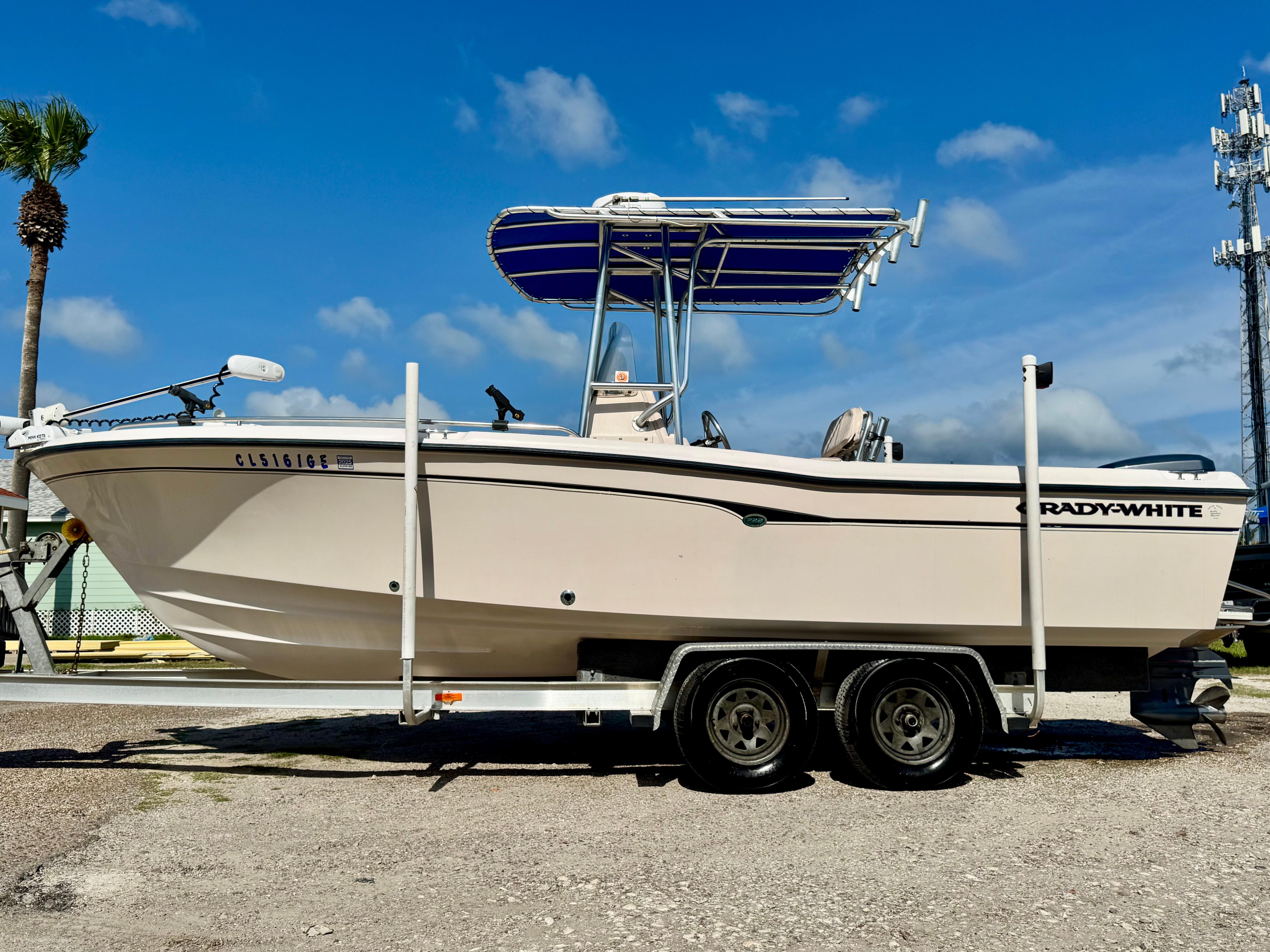 Grady-White Fisherman 222 2001 Grady-White Fisherman 222 boat on trailer under clear blue sky.