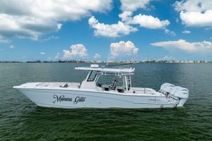 World Cat 400 CC-X 2022 World Cat 400 CC-X boat on water under blue sky with clouds.