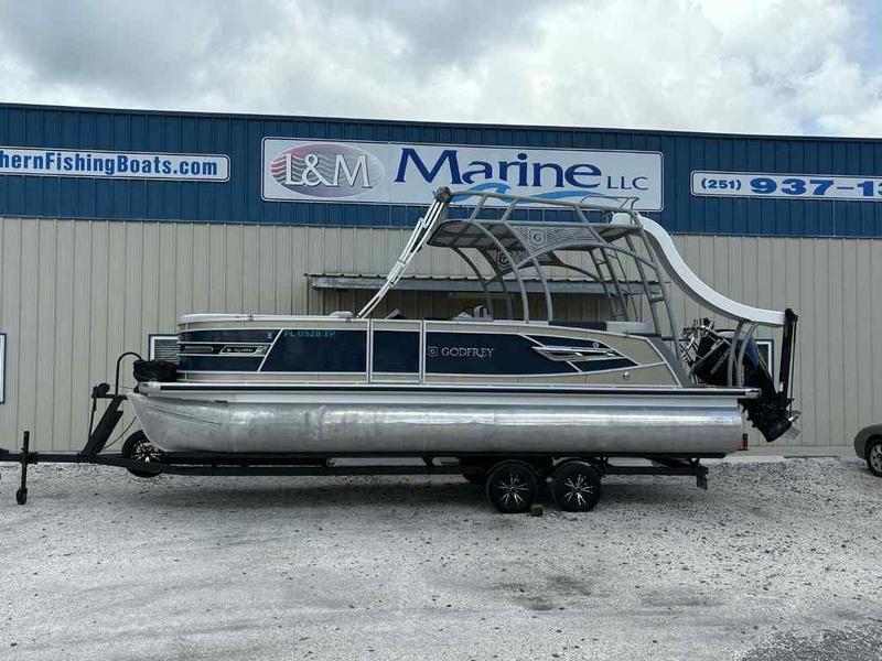 Godfrey AquaPatio 255 SDC 2023 Godfrey AquaPatio 255 SDC pontoon boat on trailer at L&M Marine dealership.