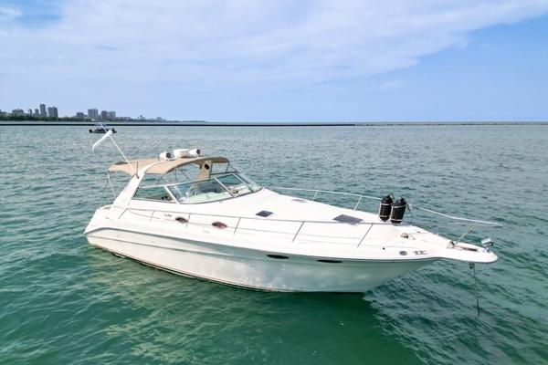 Sea Ray 330 Sundancer 1998 Sea Ray 330 Sundancer yacht on open water, clear sky background.