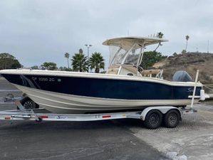 Scout 242 Sportfish 2007 Scout 242 Sportfish boat on trailer, parked outdoors.