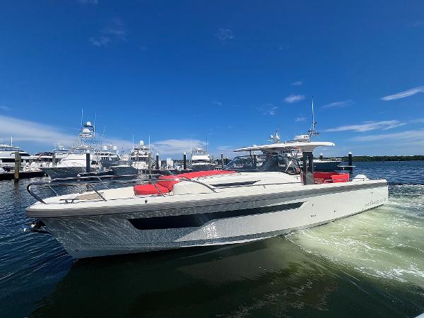 Nimbus T11 #98 TRADE! Nimbus T11 #98 TRADE! 2022 boat cruising in a marina under a clear blue sky.