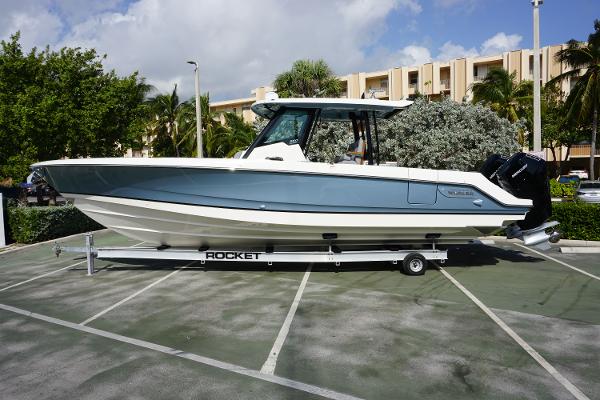Boston Whaler 360 Outrage 2024 Boston Whaler 360 Outrage boat on a trailer in a parking lot.
