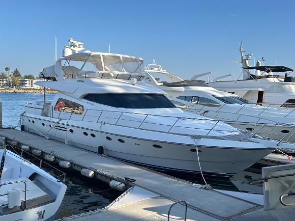 Johnson 70 Luxury 2001 Johnson 70 yacht docked at marina under clear blue sky.